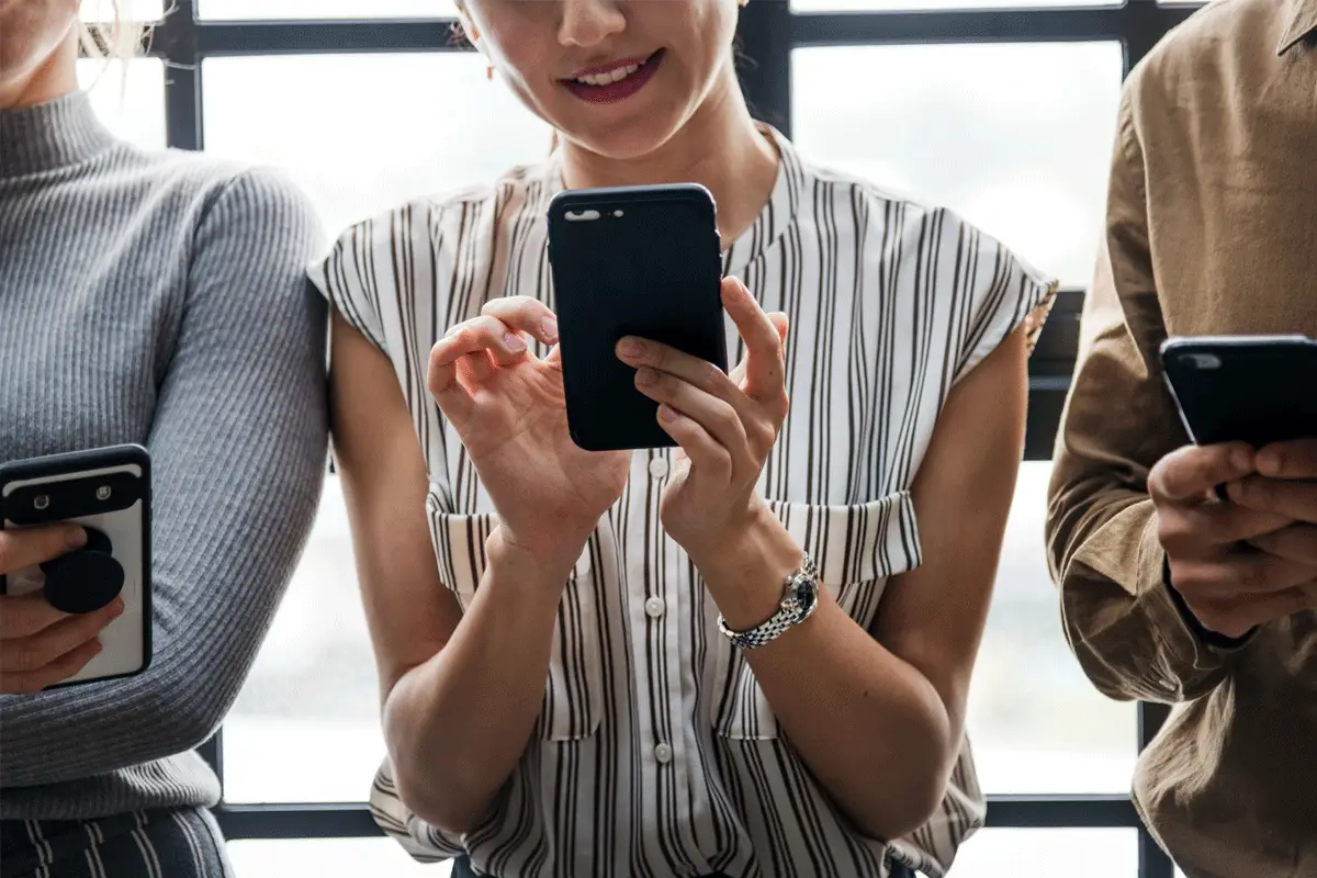 a woman sharing social media content on her social media app