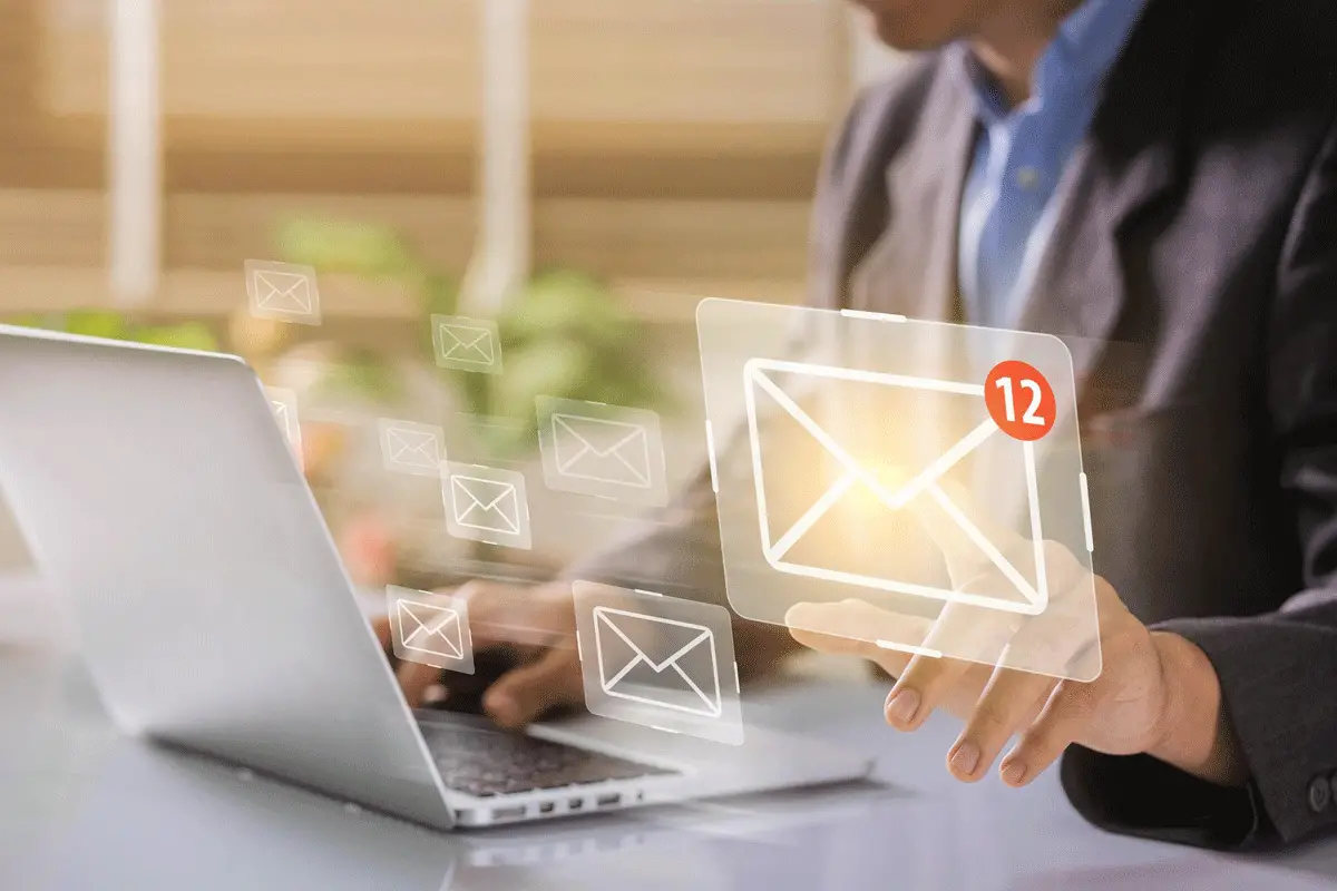 A business owner opening emails representing email marketing for small business